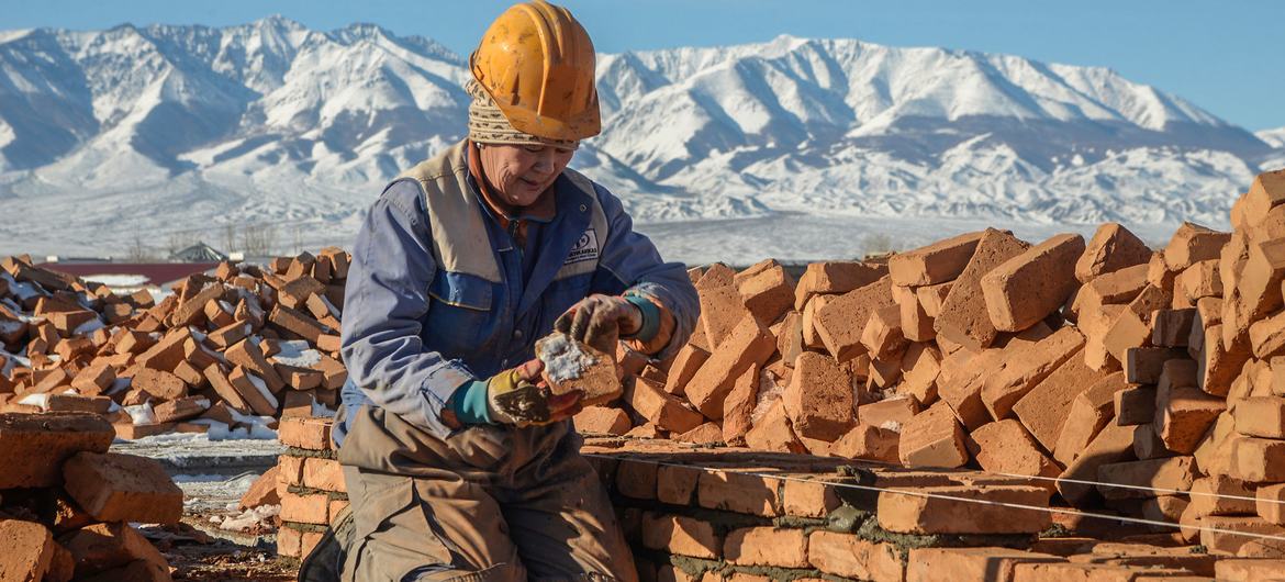Lacking access to open seas, landlocked countries must rely on other nations for imports and exports. Pictured here, a woman constructs a house in Mongolia. 