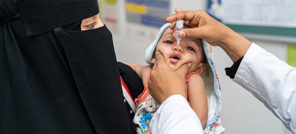 A child receives a vaccine during a nationwide immunisation drive in Yemen.