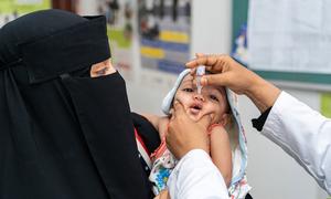 A child receives a vaccine during a nationwide immunisation drive in Yemen.