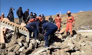 Local firefighters participate in a rescue operation after a 6.8-magnitude earthquake occurred in China's Tibet Autonomous Region.