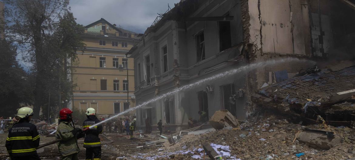 Firefighters extinguish a fire in a building struck by a missile in Kyiv, Ukraine.