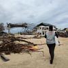 A UNFPA staff member walks to a damaged health centre in General Santos on the island of Mindanao in the Philippines.