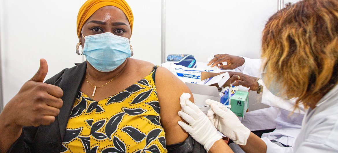 A health worker in Abidjan, Côte d'Ivoire, becomes  one of the first people to receive the COVID-19 vaccine as part of the global rollout of COVAX in Africa.