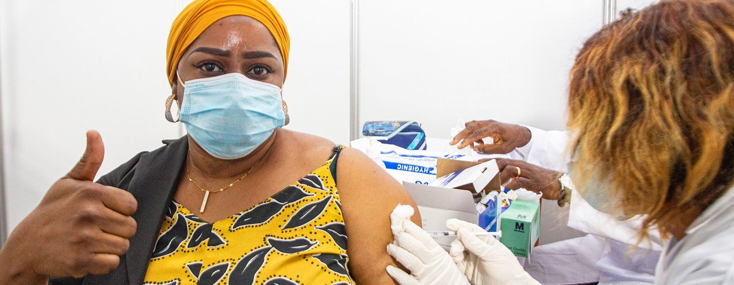 A health worker in Abidjan, Côte d'Ivoire, becomes  one of the first people to receive the COVID-19 vaccine as part of the global rollout of COVAX in Africa.