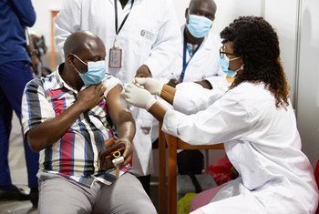 A man in Abidjan, Côte d'Ivoire, receives a COVID-19 vaccination as part of the rollout of COVAX in Africa.