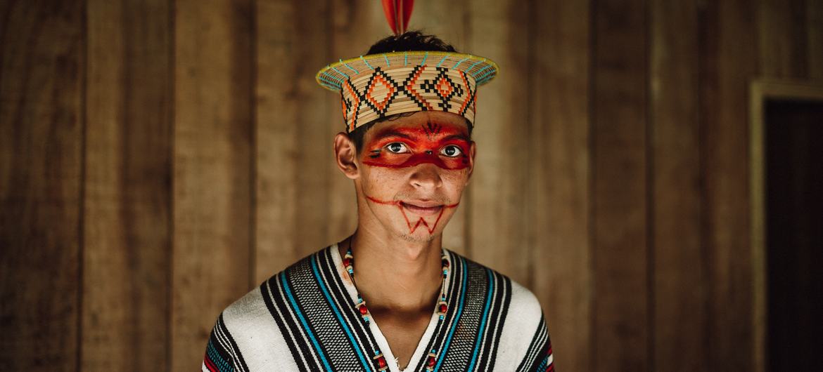 Poyowari Piyãko, a young activist, poses in his home in the Apiwtxa village, which belongs to the Ashaninka indigenous people, in northern Brazil.