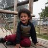 A young child with autism plays on the playground of the Alpha Learners with Autism school in Cape Town, South Africa.