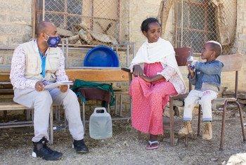 A mother who was displaced from Tigray's western zone talks to a UNICEF worker in the town of Mekelle.