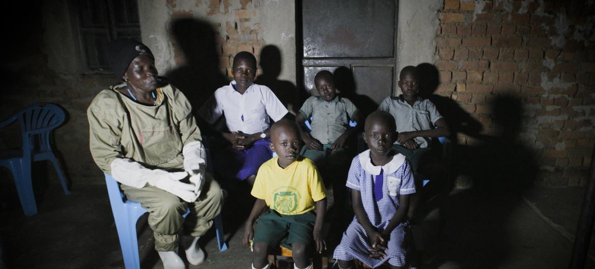 Beekeeper Betty Ayikoru and family at her home in Arua, northern Uganda