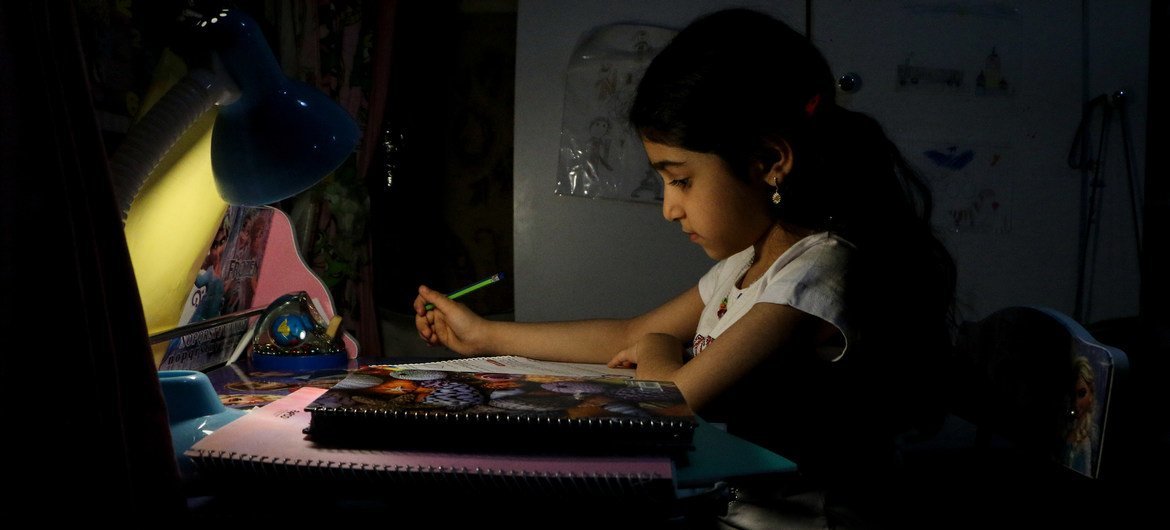 An eight-year-old child studies at home in Ahavaz, Iran, as schools are closed due to COVID-19. Many pupils in disadvantaged areas of the city do not have electronic devices and cannot access virtual lessons.