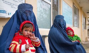 Women wait for their children to be screened for malnutrition at a clinic in Balkh Province, Afghanistan.