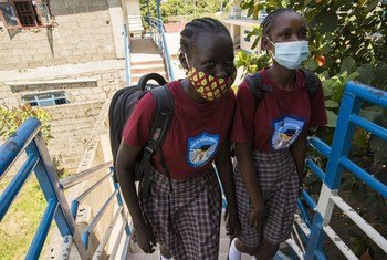Students at Darling Wisdom Academy in South Sudan walking towards the school  classroom.