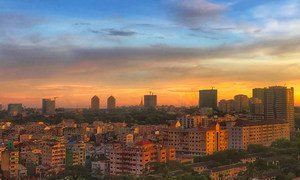 The city skyline of Yangon, Myanmar, at sunset.