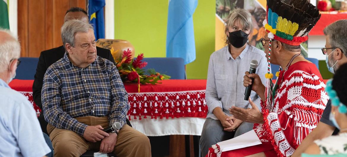 UN Secretary-General António Guterres (centre) meets with members of agricultural cooperatives led by indigenous women and men in Pierre Kondre- Redi Doti Village, in Suriname's tropical forest belt.