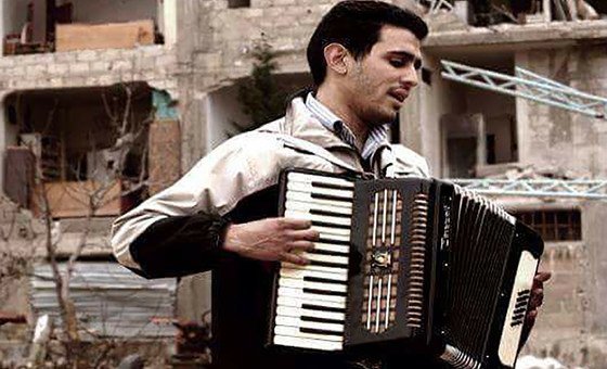 Aeham Ahmed playing Accordion in Yarmouk Camp in Damascus, Syria