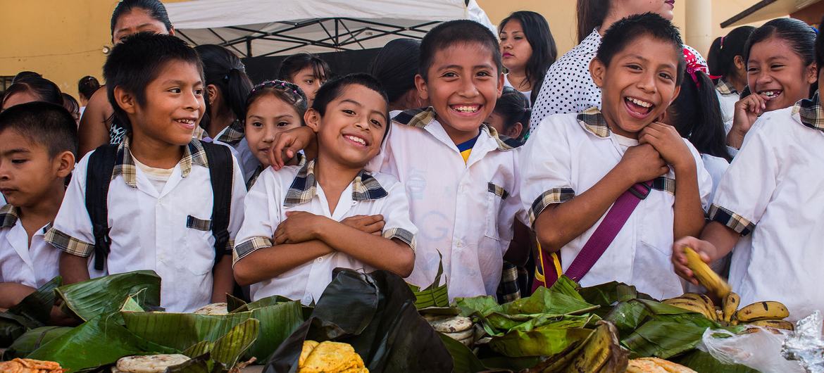 Children in schools in Sierra Gorda, Queretaro, Mexico, learn to respect the environment in a classroom while enjoying some locally produced foods.