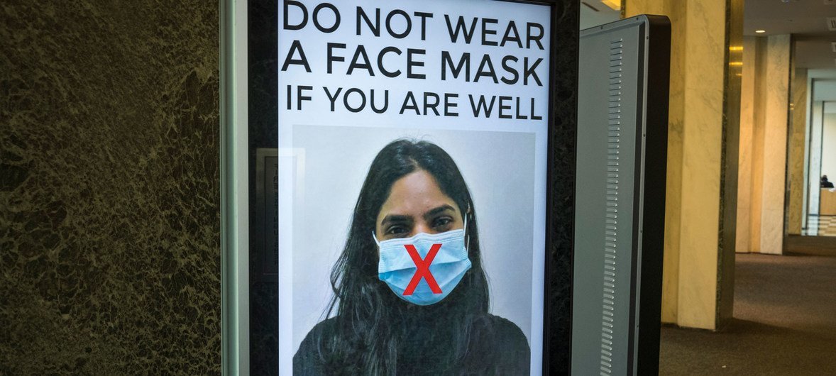 At United Nations Headquarters in New York, staff are given guidance about the use of face masks.