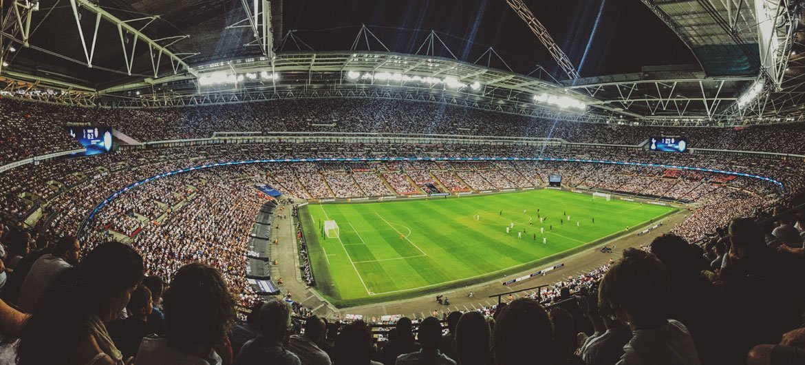 A crowd watching a football game inside Wembley Stadium in England. (September 2016)