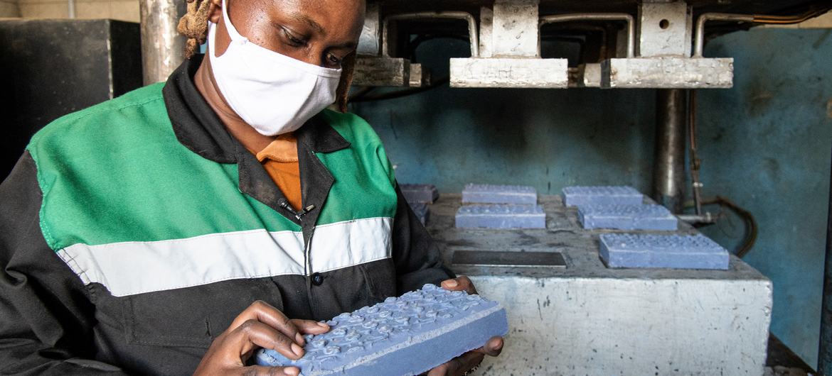 UNEP Young Champion of the Earth winner, Nzambi Matee, at her workshop where she turns plastic waste into bricks.