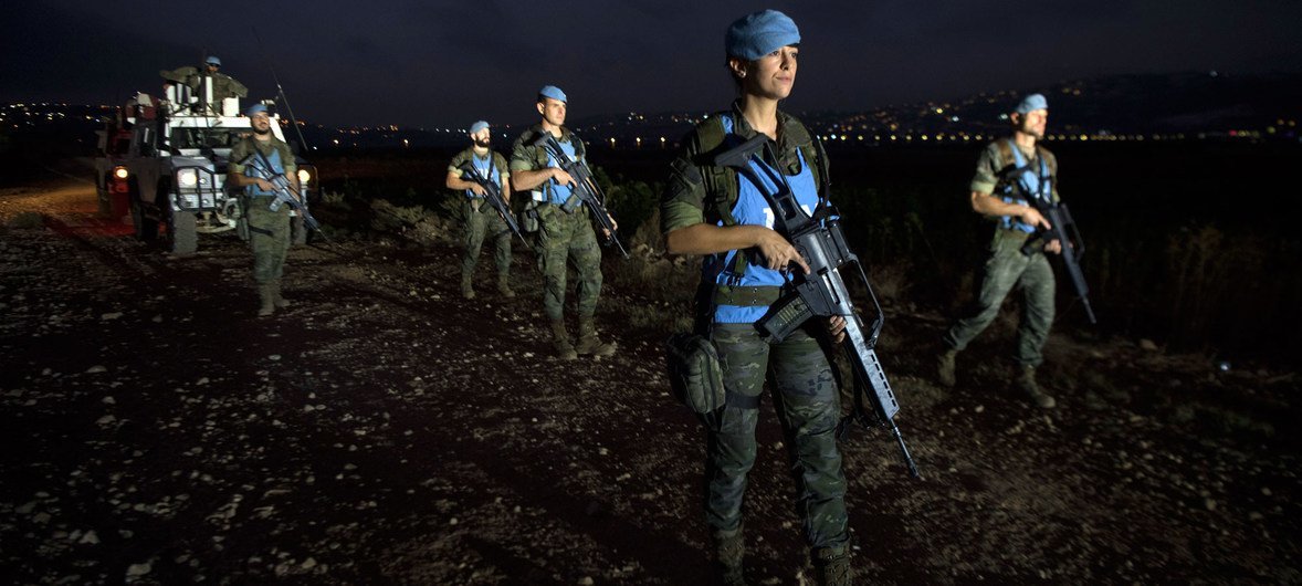 UNIFIL’s Spanish peacekeepers on an evening foot patrol along the Blue Line at the outskirts of Kafar Kela, south Lebanon. 