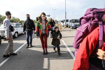 Civilians from Mariupol flee the Azovstal steel plant in Mariupol in a UN-led evacuation.