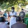 Judith  Candiru, an Assistant Nursing Officer in Yumbe district Uganda, provides COVID-19 vaccination services within the community of Midigo. 