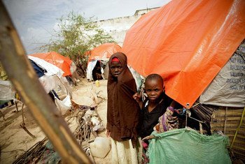 Somali children stand at a camp for Internally Displaced Persons (IDPs) in Mogadishu. 