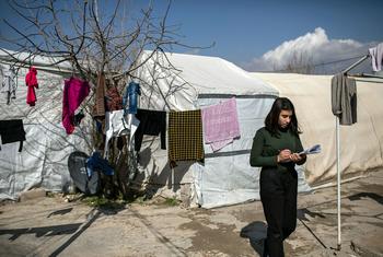 A 14-year-old Yazidi girl prepares for an exam in the Shekhan camp for internally displaced persons.