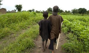 Children walk through a field in Nigeria. (file)