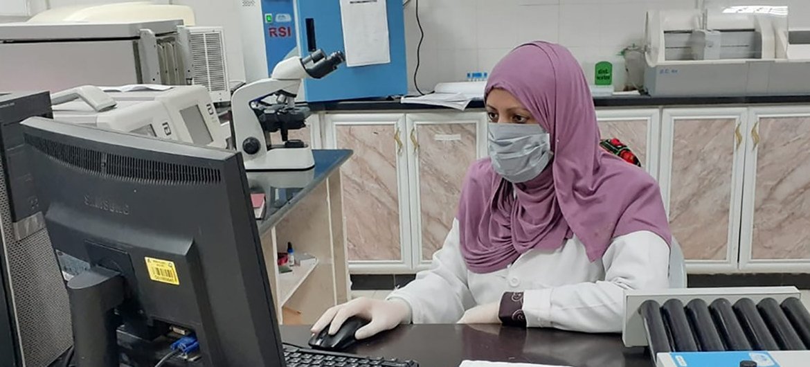 A researcher in a laboratory in Gaza analyzes data as part of efforts to fight the coronavirus.  
