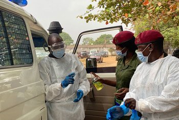 Lt. Matilda Moiwo (centre) and her colleagues prepare to collect a patient suspected of catching COVID-19.