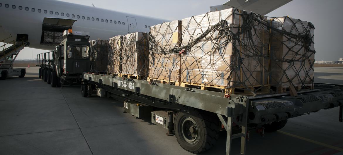 A cargo of high energy biscuits for Ukrainian refugees is offloaded at an airport in Poland.