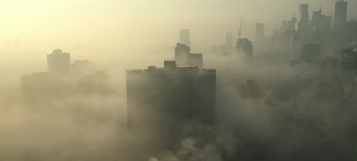 Smoke billows over the city skyline of Toronto, Canada.