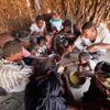 A family shares a meal in Yemen with food provided by the UN World Food Programme (WFP).