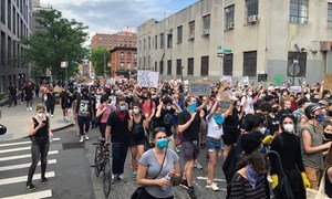 In Brooklyn, New York, protesters peacefully demonstrate against police violence, following the death of George Floyd, in May 2020.. 