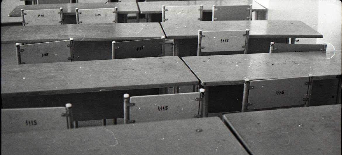 School desks and chairs in a classroom. (file)