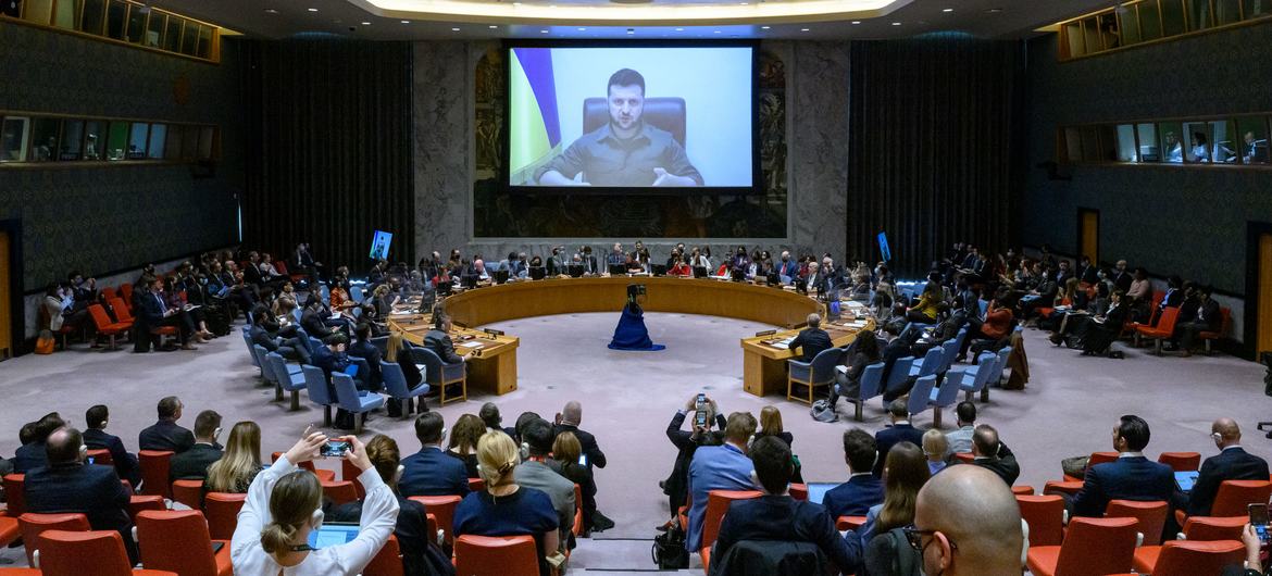 A wide view of the Security Council Chamber as President Volodymyr Zelenskyy (on screen) of Ukraine, addresses the Security Council meeting on the situation in Ukraine.
