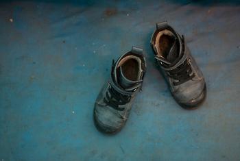 Boy's shoes are shown at the Red Cross tent for mother's and children at Lviv train station in Ukraine.