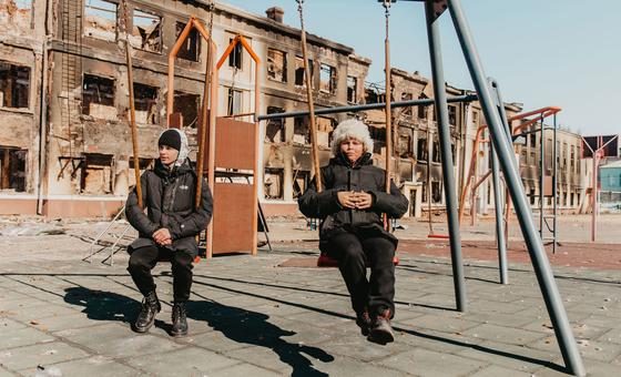 Two 14-year-olds play on the swings at their former school in Kharkiv, northeast Ukraine, after it was destroyed by shelling.