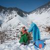 A healthcare worker from a clinic in North Kashmir braves freezing temperatures and snow to vaccinate people living in remote areas of India.