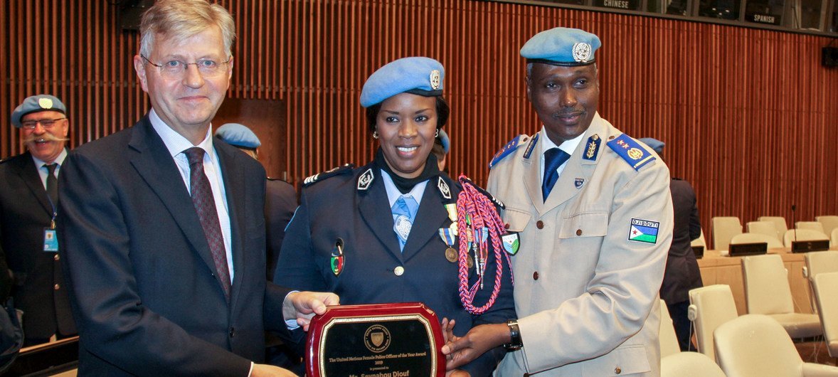 From left, UN Under-Secretary-General for Peacekeeping Operations, Jean-Pierre Lacroix, UN Female Police Officer of the Year Major Seynabou Diouf and MONUSCO Police Commission Awale Abdounasir at the award ceremony. (5 November 2019)