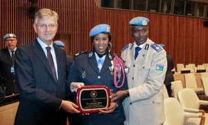 From left, UN Under-Secretary-General for Peacekeeping Operations, Jean-Pierre Lacroix, UN Female Police Officer of the Year Major Seynabou Diouf and MONUSCO Police Commission Awale Abdounasir at the award ceremony. (5 November 2019)
