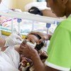 A 7-month-old baby is treated at a hospital in Samoa following an outbreak of measles on the Pacific Ocean island.