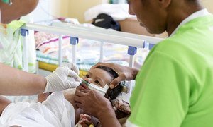 A 7-month-old baby is treated at a hospital in Samoa following an outbreak of measles on the Pacific Ocean island.