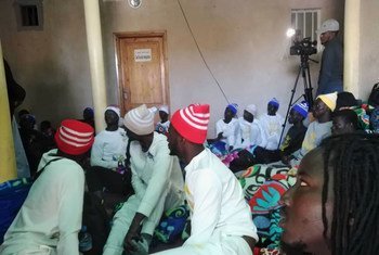 Survivors of the boat that capsized near the coast of Mauritania wait to receive assistance in Nouadhibou.