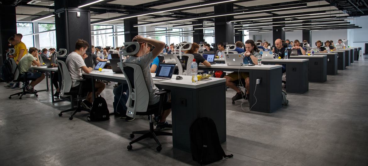 Software developers in an open space work area.