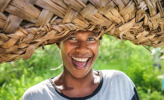 A woman coming back from a field in Port Vila, Vanuatu.