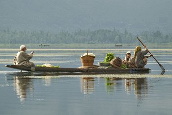A family transports produce to the maket in Srinagar, Jammu and Kashmir.