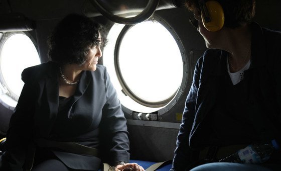 Leila Zerrougui (left), Special Representative of the UN Secretary General in the Democratic Republic of the Congo, looks out a helicopter during a flight to Ituri and North Kivu Provinces.