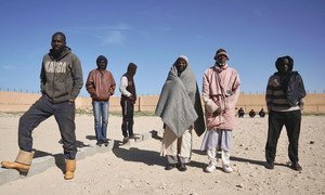 At the Qanfoodah Detention Centre in Benghazi, Libya, male African detainees wait to be declared present at a morning roll call.